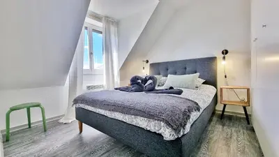 Un ou plusieurs lits dans un hébergement de l'établissement Colmar Mon Amour-CHIC-GARAGE-FIBRE-RBNB