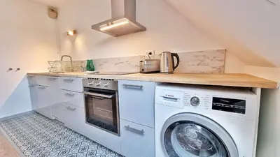 Cuisine ou kitchenette dans l'établissement Colmar Mon Amour-CHIC-GARAGE-FIBRE-RBNB