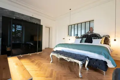 Un ou plusieurs lits dans un hébergement de l'établissement L'appartement du château